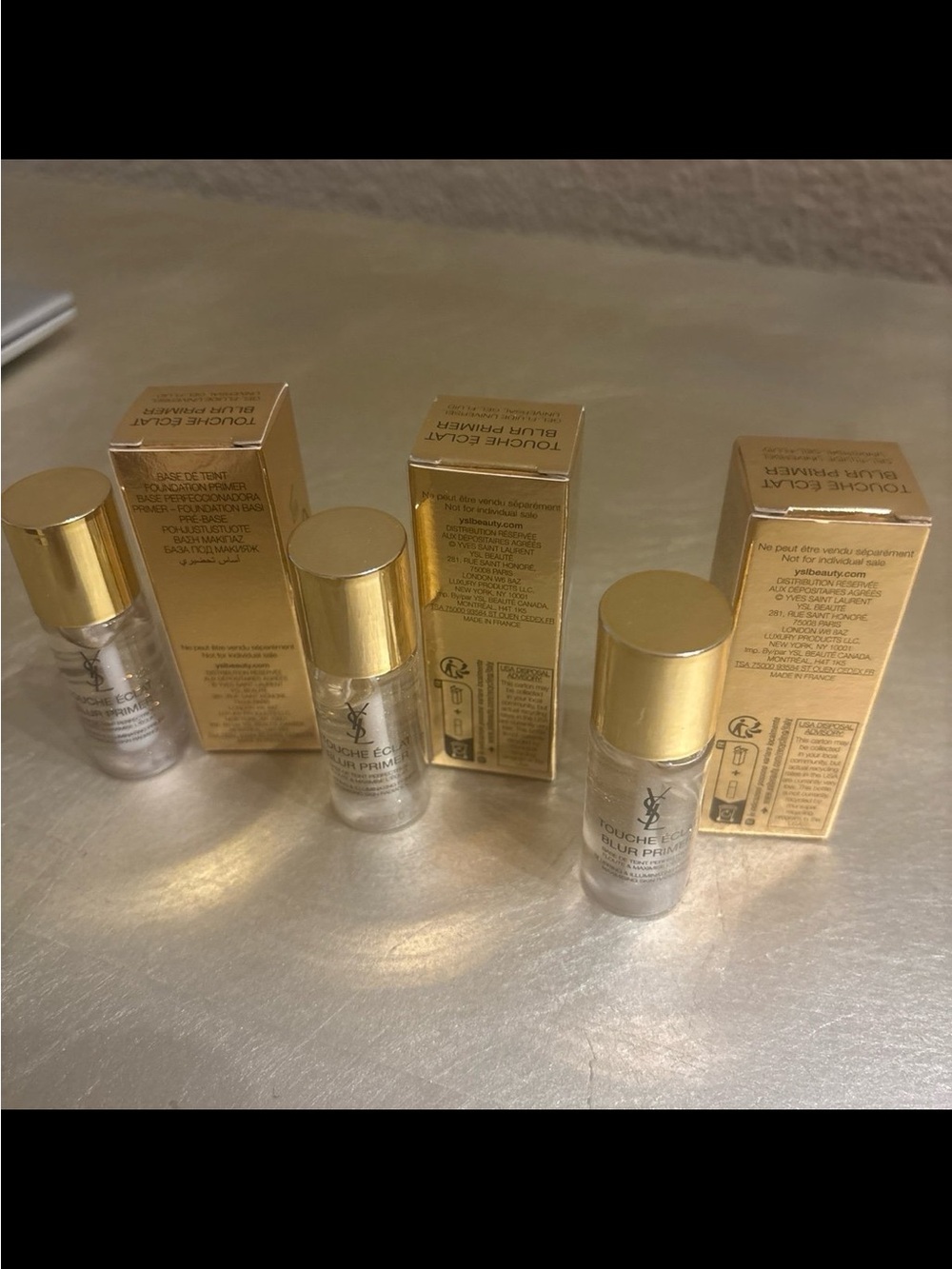 Yves Saint Laurent Blur Primer Bottles in Gold and Clear